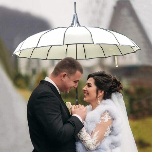 Married couple under white pagoda peak fashion umbrella