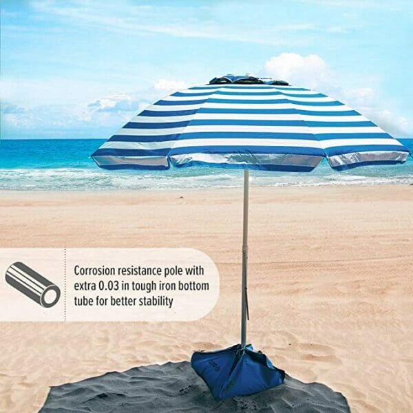 White and light blue umbrella on the beach