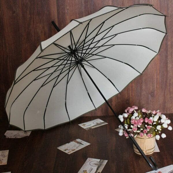 White pagoda peak fashion umbrella on the floor with flowers