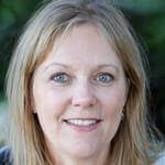 a woman smiling for the camera