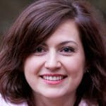 a woman smiling for the camera