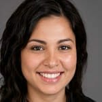 a woman smiling for the camera