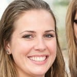 a woman smiling and posing for the camera