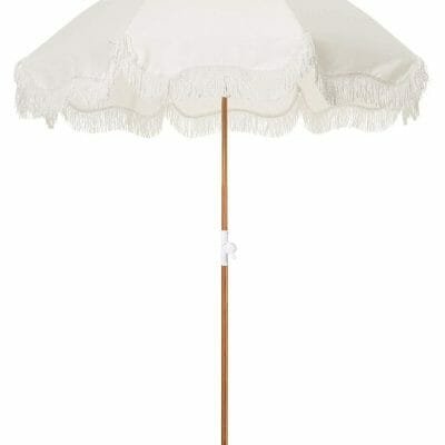 A 5.5 Ft Fringe Cotton Beach Umbrella with tassels on it.