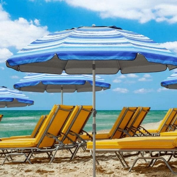 a group of lawn chairs sitting on top of a beach