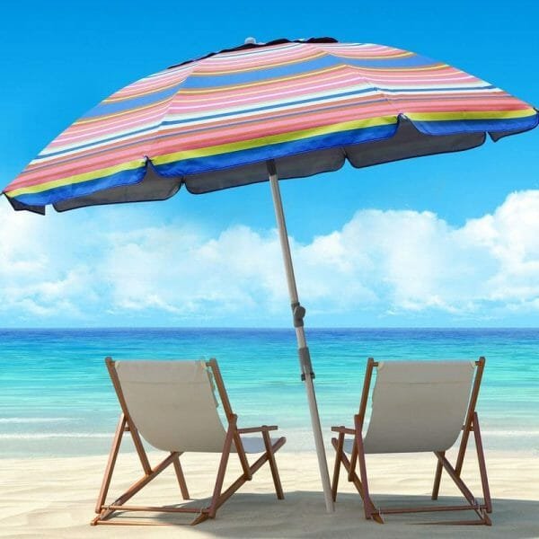 a row of lawn chairs sitting on top of a beach