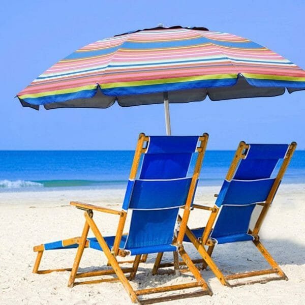 a group of lawn chairs sitting on top of a beach