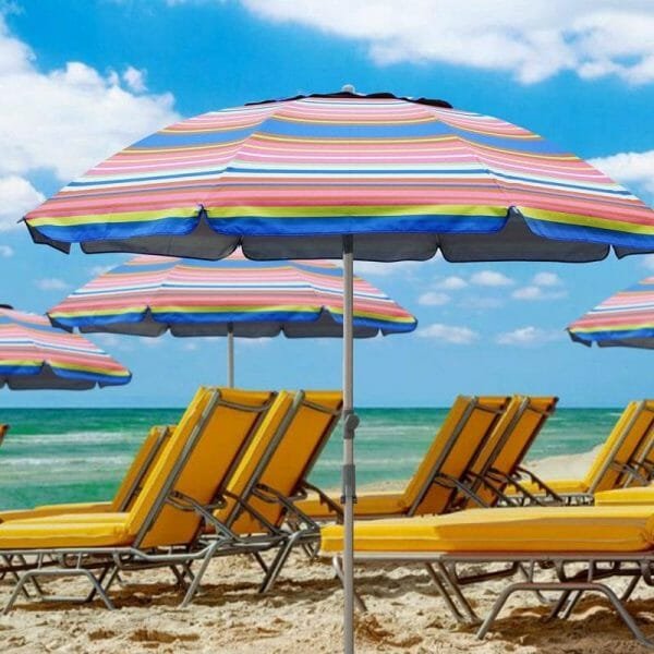 a group of lawn chairs sitting on top of a beach