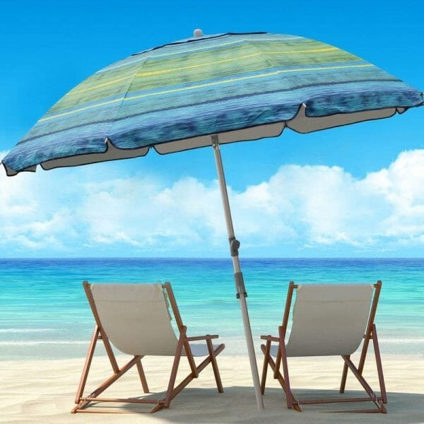 an umbrella sitting on top of a beach