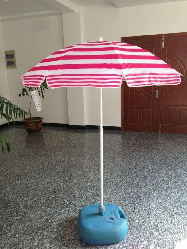 A 1.2M Polyester Beach Umbrella sitting on a blue base.