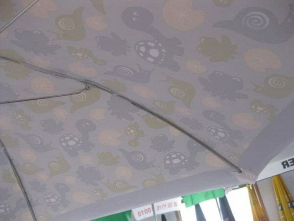 A 1.2M Polyester Beach Umbrella with a pattern on it.