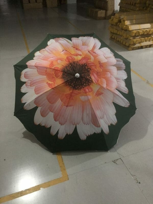 a pink flower on a table