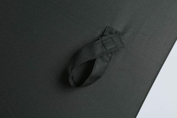 A close up of a 27in Black UV Single Layer Auto Golf Umbrella with a zipper.