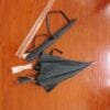 Two 27in Aluminum Single Layer Auto Golf Umbrellas on a wooden floor.