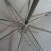 A close up of a 27in Aluminum Single Layer Auto Golf Umbrella with a metal frame.