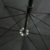 A close up of a 27inch Manual Open Golf Umbrella on a black background.
