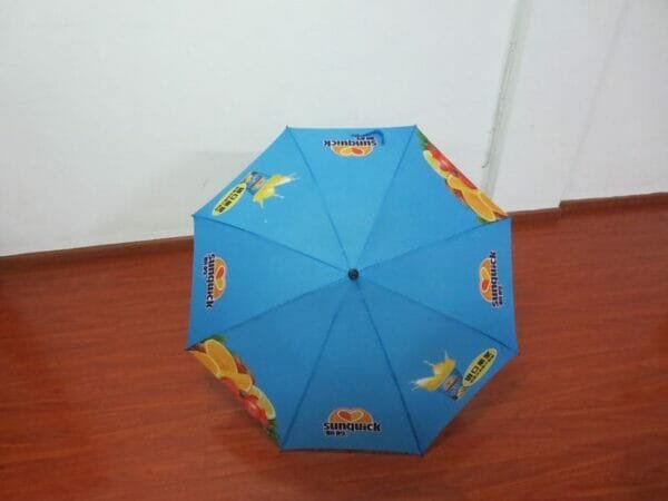 A 30in Single Layer Auto Golf Umbrella is sitting on a wooden floor.