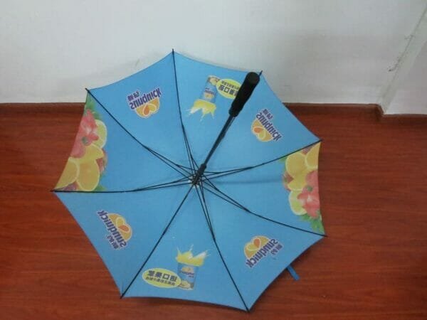 A blue 30in Single Layer Auto Golf Umbrella with an advertisement on it.