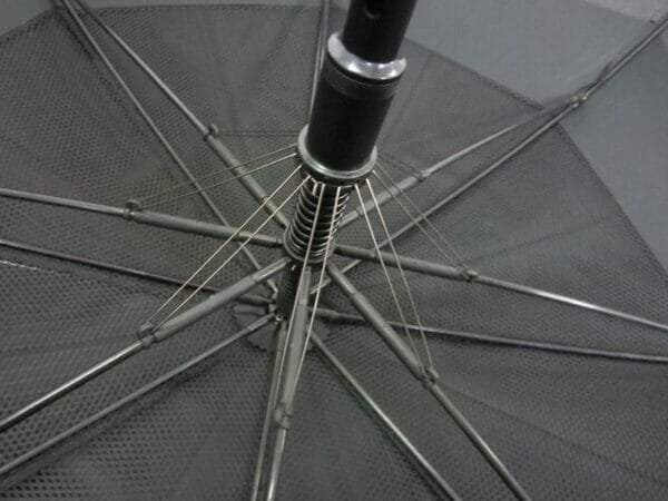 A close up of a 30inch Double Layer Golf Umbrella with a metal frame.