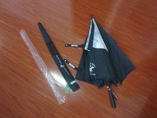 A 30inch Double Layer Golf Umbrella with a black handle and a plastic handle.