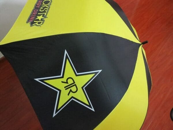 A yellow and black 30inch Double Layer Golf Umbrella 190T with a star on it.