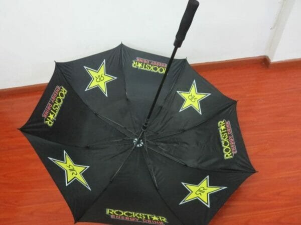 A 30inch Double Layer Golf Umbrella 190T with yellow stars on it.