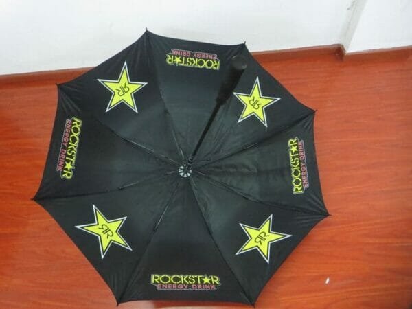 A black 30inch Double Layer Golf Umbrella 190T with a rockstar logo on it.