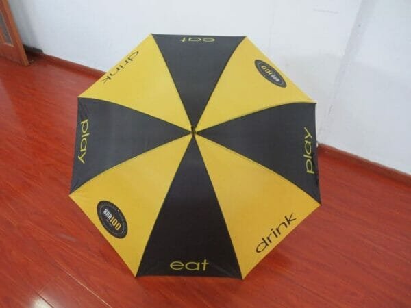 A 30inch Cheap Golf Umbrella on a wooden floor.