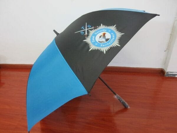 A blue and black Single Layer Umbrella For Golf | ARDECO with a police emblem on it.