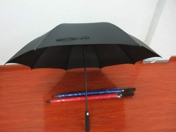 A 30in Single Layer Auto Golf Umbrella Plain with a red, blue and black pen.