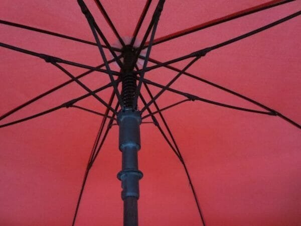 A close up of a 30in Single Layer Auto Golf Umbrella Plain with a black handle.