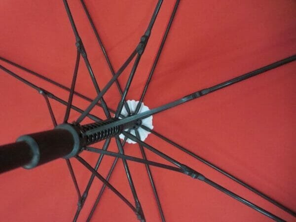 A 30in Single Layer Auto Golf Umbrella Plain on a red background.