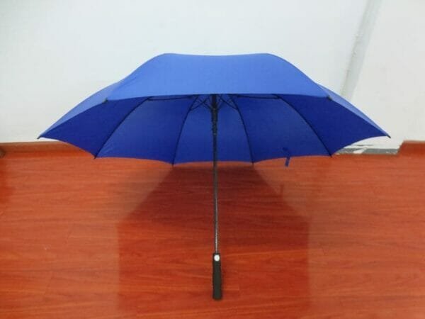 a blue umbrella in the rain