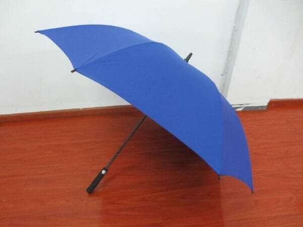 a blue umbrella in the rain