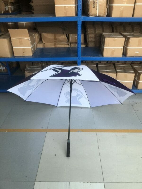 A 30in 280T Single Layer Auto Golf Umbrella sitting in a warehouse.