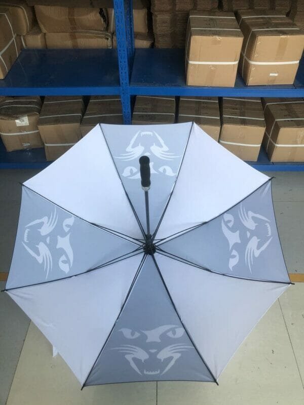 A 30in 280T Single Layer Auto Golf Umbrella in a warehouse.