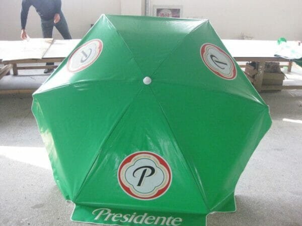 A 1.6m PVC Beach Umbrella with a logo on it.