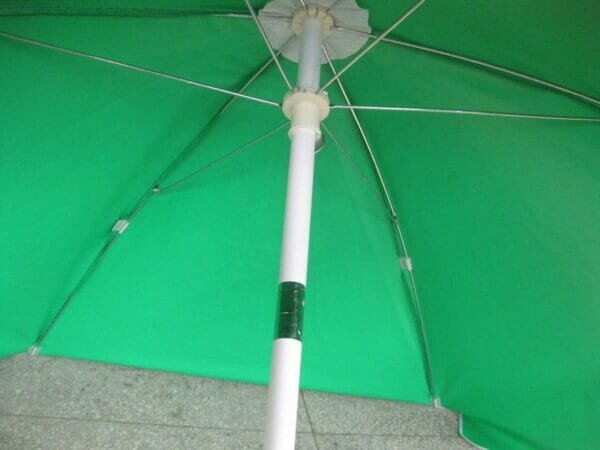 A 1.6m PVC Beach Umbrella with a white pole.