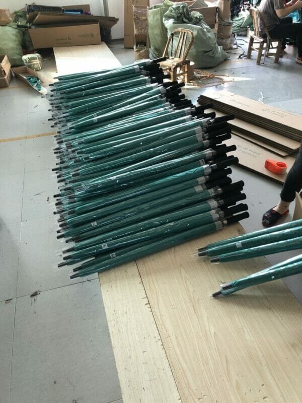 A group of 30inch Double Layer Golf Umbrellas UV Coated in a warehouse.