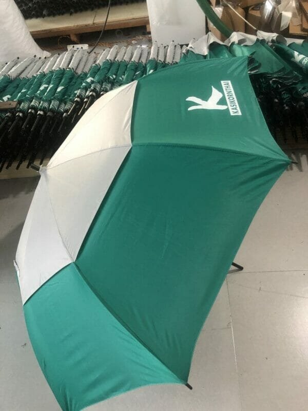 A 30inch Double Layer Golf Umbrella UV Coated in a warehouse.