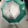 A 30inch Double Layer Golf Umbrella UV Coated is open in a warehouse.