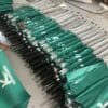 A group of 30inch Double Layer Golf Umbrella UV Coated umbrellas in a warehouse.
