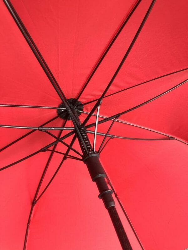 A close up of a 30in Single Layer Auto Golf Umbrella Printed with a black handle.