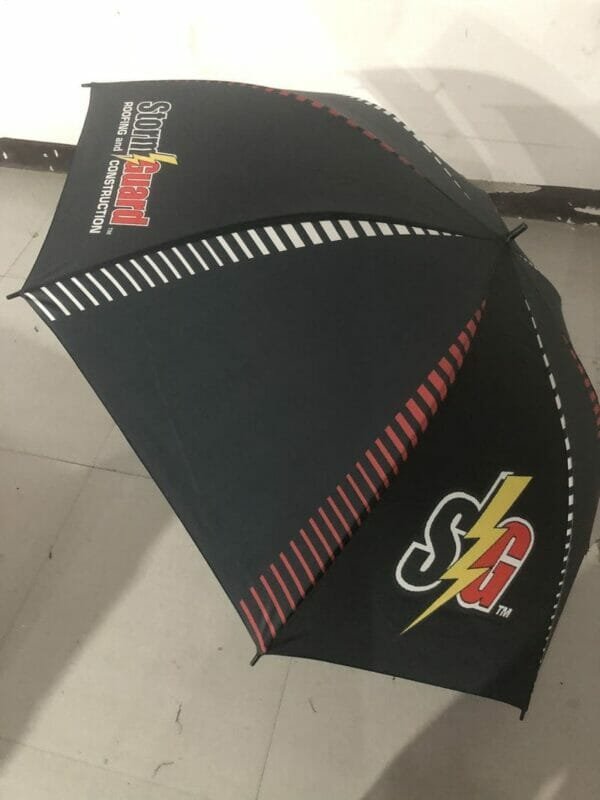 A 32in Single Layer Auto Golf Umbrella with a logo on it.