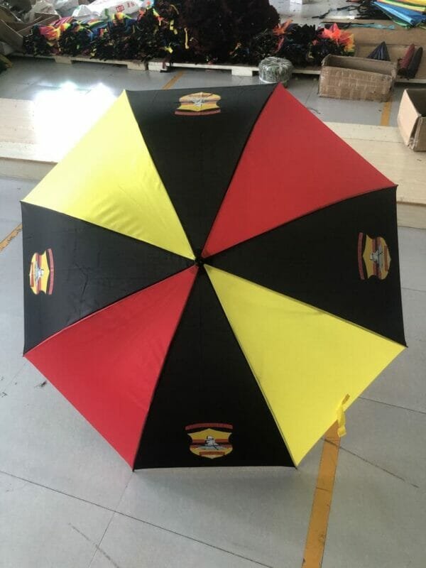 A 30in 190T Single Layer Auto Golf Umbrella in a warehouse.