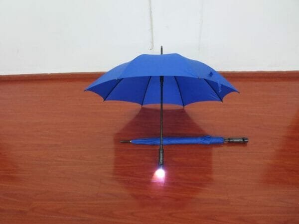 a blue umbrella in the rain