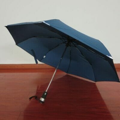 an umbrella sitting on top of a wooden table