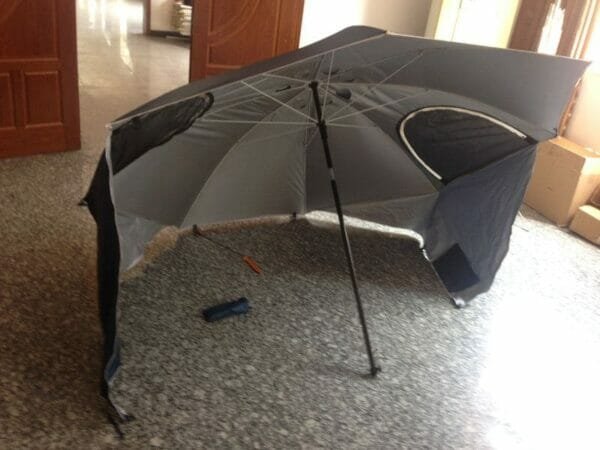 a close up of an umbrella on the floor in a room