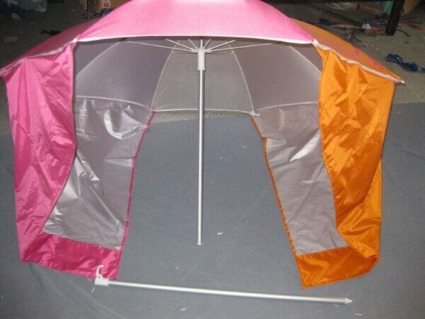 a tent with a pink umbrella