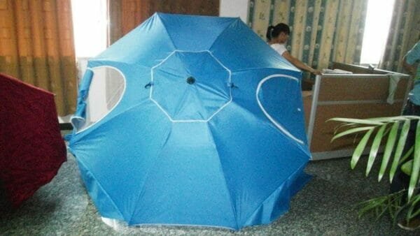 a table topped with a blue umbrella